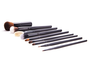 Some different kind of make-up brushes isolated on white