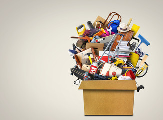 Large pile of household things in a box