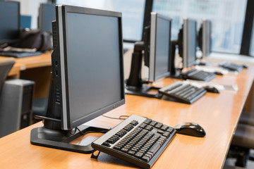 Empty computer room neatly placed for student.