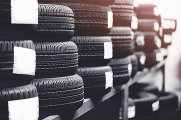 Tires for sale at a tire store.Black and white tone.