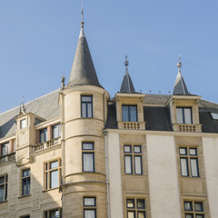 Fototapeta na wymiar Small towers on top of Chamber of Deputies building in historical center of Luxembourg city.
