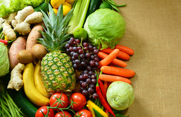 Colorful and various types of vegetables and fruits on sack background