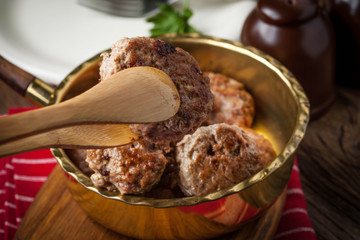 Fried pork chops in the pan.