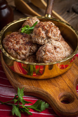 Fried pork chops in the pan.