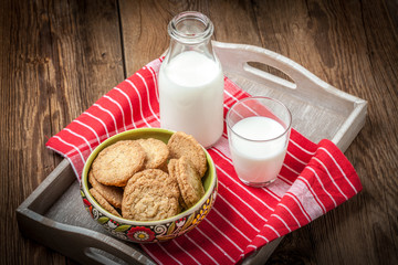 Stack of freshly baked oat biscuits in a bowl.