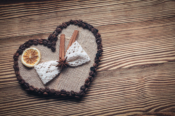 decorated heart on a wooden background