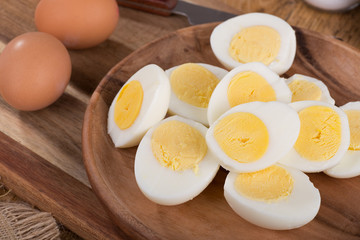 Sliced Hard Boiled Eggs on a Wooden Plate