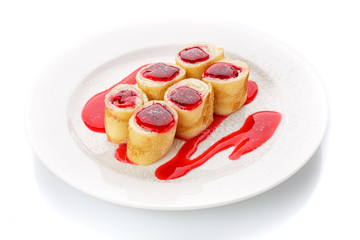 Fresh sweet homemade pancakes with cheese and strawberry sauce
