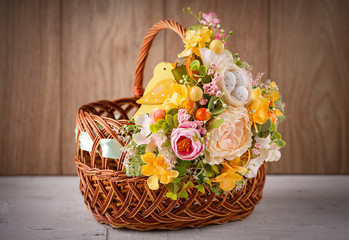 Fototapeta na wymiar Decorative basket decorated with flowers