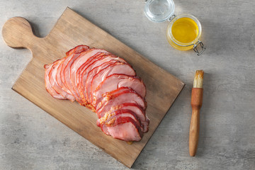 Delicious sliced honey baked ham on wooden board