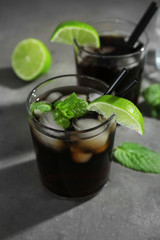Glass of Cuba Libre cocktail on table