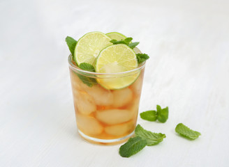Glass with Cuba Libre cocktail on windowsill