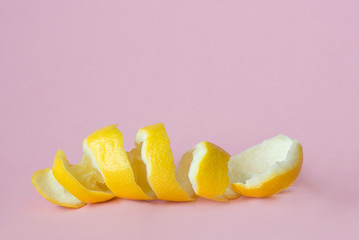 lemon peel on pink background as a symbol of recycling circulate economy