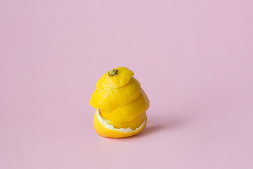 lemon peel on pink background as a symbol of recycling circulate economy