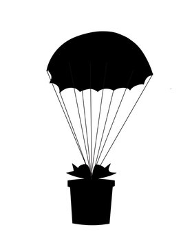 Black silhouette of gift wrapped with bow falling down with  parachute