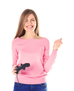 Happy woman with video game controller on white background