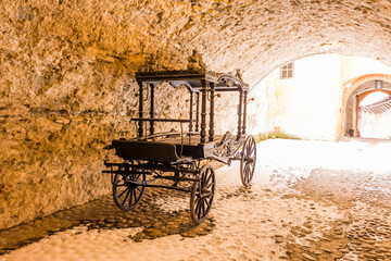 Fototapeta na wymiar Historic and old carriage, transportation in old castle