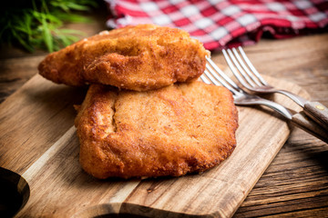 Two fried cod fillet pieces.