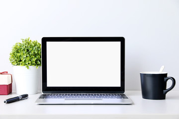 Fototapeta premium Working with Laptop computer,Hot coffee and cactus copy space on desk background,business Concept