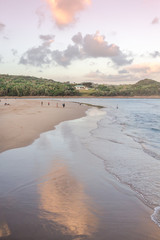 Gonubie beach river mouth at sunset. Late day fun at the seaside. Holiday background
