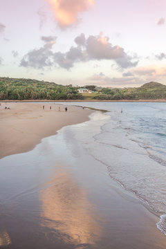 Gonubie beach river mouth at sunset. Late day fun at the seaside. Holiday background
