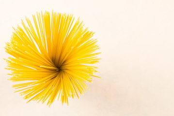 Yellow pasta on white isolated background close up mackro.