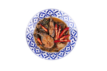 Isolated of Spicy sliced catfish curry in coconut milk with Morinda citrifolia leaf .