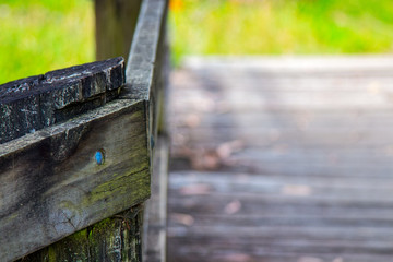 Old wooden bridge and railing closeup