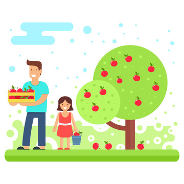 A happy family collects apple crops.