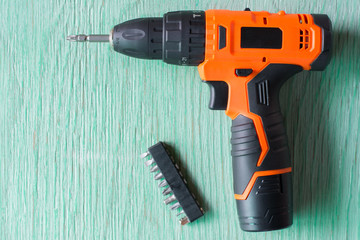 drilling wood battery drill,Cordless drill on wood background,