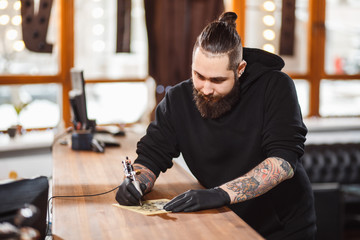 Portrait of professional creative tattoo master