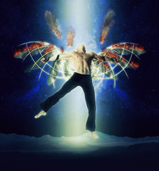 Obraz premium A man with wings on a background of dark sky