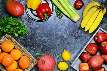 Fresh fruits and vegetables on the dark background. Top view fruits and vegetables. Shopping basket. Shopping list