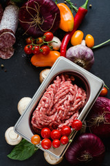 Assortment of homemade meat products. Italian salami recipe. Cooking with fresh ingredients concept