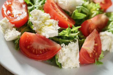 Fresh summer salad with tomatoes, arugula and mozzarella