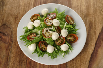 Caprese salad variation with kumato tomatoes and frillies leaves