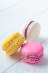 French Macaroon cake set on wooden white table. Delicious sweet dessert.