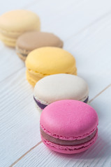 French Macaroon cake set on wooden white table. Delicious sweet dessert.