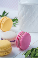 French Macaroon cake set on wooden white table. Delicious sweet dessert.