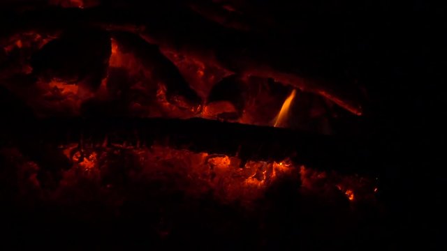 Campfire fire on hot coals at night, slow motion, full hd video footage