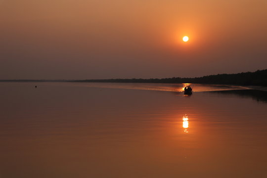 Fototapeta Beautiful sunset over the river Bidyadhari in Sundarban