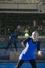 One women 47 years old playing Paddle tennis