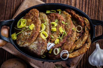 traditional hanukkah fried potato pancakes in black iron cast pan 