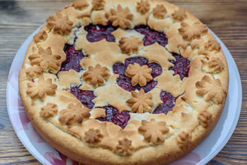 sand pie on a dark wooden background