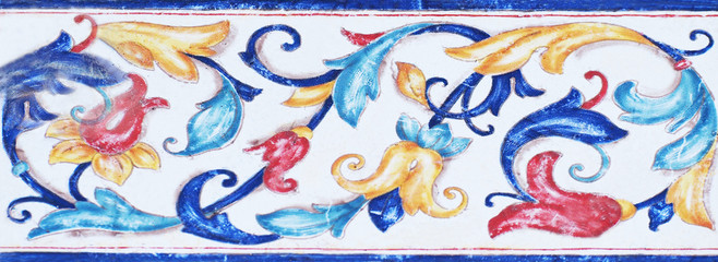 Detail of the traditional tiles from facade of old house. Decorative tiles.Valencian traditional tiles. Floral ornament.