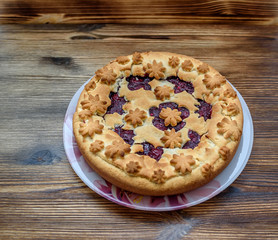 sand pie on a dark wooden background