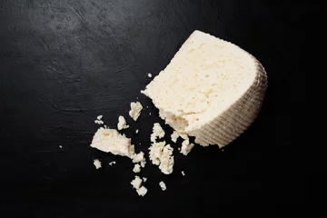 Crédence de cuisine en verre imprimé Produits laitiers greece feta cheese on dark background. farming industry. milk products. gourmet food.