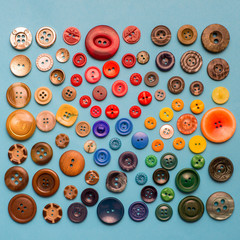 Collection of various sewing button on blue background