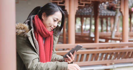 Woman looking mobile phone in China