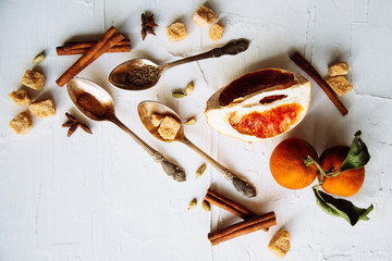 Celebrate new year winter evening with hot drink. Mulled wine or grog ingredients. White background top view. Space for text